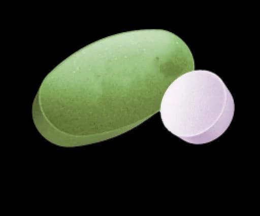 An illustrative green tablet and a small pale tablet